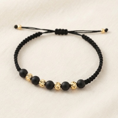 Pulsera Jaguar Nocturno, Pulsera de macramé y balines de oro laminado modelo Jaguar.